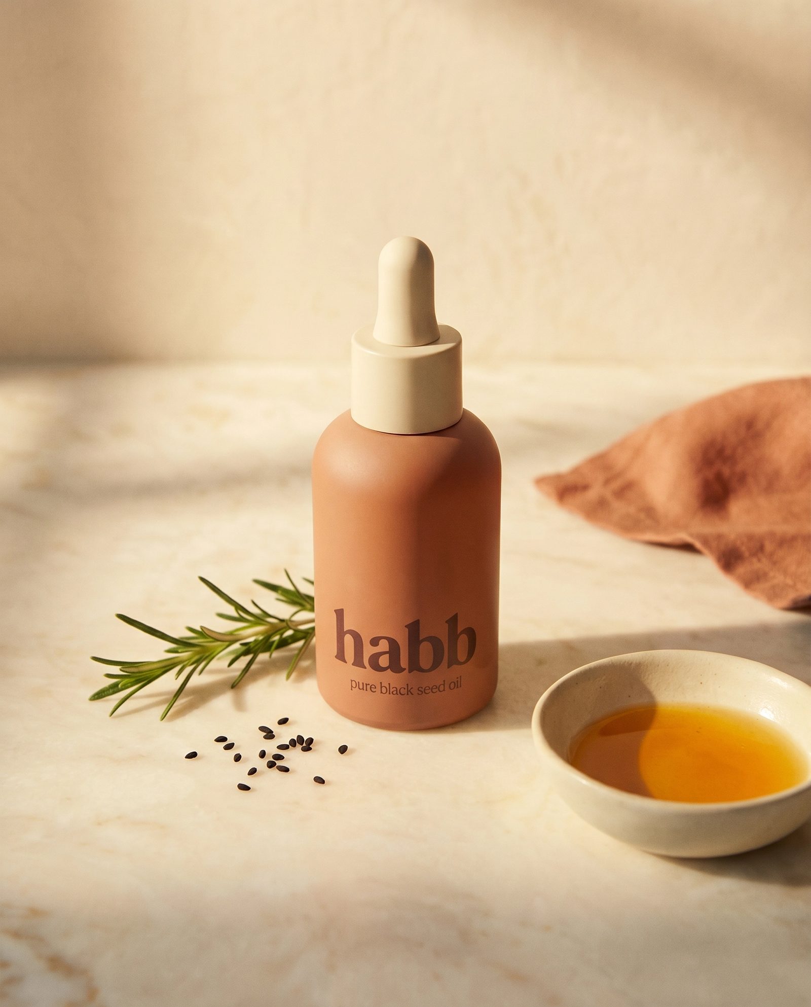 golden oil pooling on cream surface